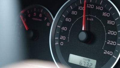 Photo of a speedometer showing speeding